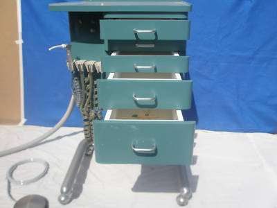 Dental mobil cabinet with operating unit and vac pkg.
