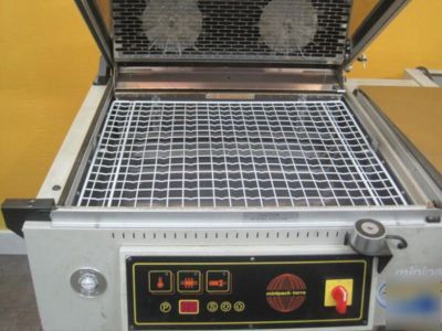 Synthesis 760 shrink wrapper sealer on stand w/wheels