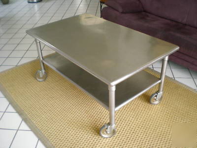 Contemporary modern stainless coffee table w/ casters