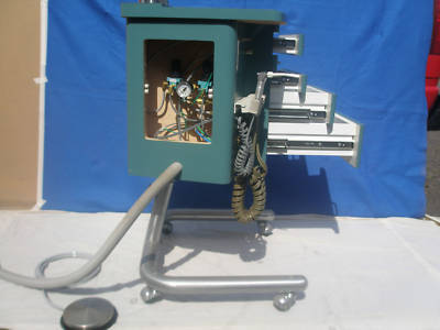 Dental mobil cabinet with operating unit and vac pkg.