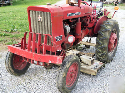 1974 farmall 140 tractor w/ woods L59 belly mower